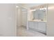 En suite bathroom features double sinks and access to walk-in closet at 1928 Shadow Glen Dr, Raleigh, NC 27604