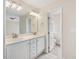 En suite bathroom features double sinks and an entrance to the water closet at 1928 Shadow Glen Dr, Raleigh, NC 27604