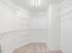 Walk-in closet has extensive wire shelving for optimal storage at 1928 Shadow Glen Dr, Raleigh, NC 27604