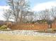Hedingham Golf & Athletic Club brick sign with stone accents surrounded by trees at 1928 Shadow Glen Dr, Raleigh, NC 27604