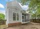 Exterior view of home featuring screened in porch and well manicured lawn at 1928 Shadow Glen Dr, Raleigh, NC 27604