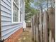 Exterior view of home featuring side yard and privacy fence at 1928 Shadow Glen Dr, Raleigh, NC 27604
