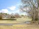 Scenic view of the golf course with well manicured grass and mature trees at 1928 Shadow Glen Dr, Raleigh, NC 27604