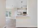 Kitchen featuring stainless steel appliances and white cabinets, open to the living area at 1928 Shadow Glen Dr, Raleigh, NC 27604