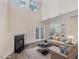 Bright, open living room with high ceilings, fireplace, and access to the backyard at 1928 Shadow Glen Dr, Raleigh, NC 27604