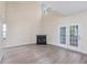 Bright living room with a fireplace, French doors, and vaulted ceilings at 1928 Shadow Glen Dr, Raleigh, NC 27604