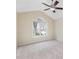Empty main bedroom with vaulted ceiling, ceiling fan, and a large arched window at 1928 Shadow Glen Dr, Raleigh, NC 27604