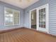 Spacious screened porch with wood flooring and access to the home interior at 1928 Shadow Glen Dr, Raleigh, NC 27604