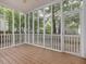 Relaxing screened-in porch with wood flooring and views of the backyard at 1928 Shadow Glen Dr, Raleigh, NC 27604