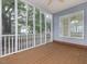 Charming screened-in porch with wood flooring and tranquil backyard views at 1928 Shadow Glen Dr, Raleigh, NC 27604