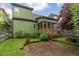 Landscaped backyard featuring a stone patio and nice yard at 1930 Briar Chapel Pkwy, Chapel Hill, NC 27516