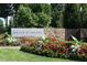 Stone monument sign identifying Briar Chapel amid colorful flowers at 1930 Briar Chapel Pkwy, Chapel Hill, NC 27516