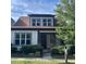 Charming home with a manicured lawn, complemented by mature landscaping and a welcoming facade at 1930 Briar Chapel Pkwy, Chapel Hill, NC 27516
