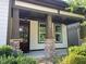 Inviting front porch with stone accents on the columns, showcasing the home's appealing entrance at 1930 Briar Chapel Pkwy, Chapel Hill, NC 27516