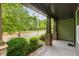 Inviting front porch featuring stone pillars and a view of the street at 1930 Briar Chapel Pkwy, Chapel Hill, NC 27516