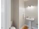 Modern half bath with pedestal sink, stylish fixtures, and neutral decor at 1930 Briar Chapel Pkwy, Chapel Hill, NC 27516