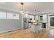 Modern kitchen featuring white cabinets, stainless steel appliances, and a center island with black countertop at 1930 Briar Chapel Pkwy, Chapel Hill, NC 27516