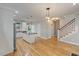 Open living space with a hardwood floor and a stairway at 1930 Briar Chapel Pkwy, Chapel Hill, NC 27516