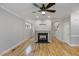 Cozy living room featuring a fireplace, hardwood floors, and natural light at 1930 Briar Chapel Pkwy, Chapel Hill, NC 27516