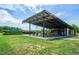 Community picnic pavilion on a grassy area features picnic tables and an open design at 1930 Briar Chapel Pkwy, Chapel Hill, NC 27516