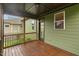Screened porch with wood flooring and view to the green backyard at 1930 Briar Chapel Pkwy, Chapel Hill, NC 27516