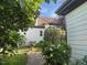Well-maintained side yard with lush landscaping and a charming brick pathway, adding to the property's appeal at 1930 Briar Chapel Pkwy, Chapel Hill, NC 27516
