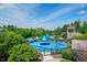 Community splash pad features a circular pool and water features under a bright blue sky at 1930 Briar Chapel Pkwy, Chapel Hill, NC 27516