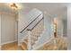 Beautiful staircase with hardwood floors and white risers at 1930 Briar Chapel Pkwy, Chapel Hill, NC 27516