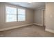 Carpeted bedroom with neutral walls and double windows letting in plenty of natural light at 1930 Reid St, Raleigh, NC 27608