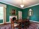 Formal dining room with an ornate fireplace and elegant decor at 1930 Reid St, Raleigh, NC 27608