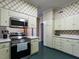 Well-equipped kitchen featuring stainless steel appliances and ample cabinet storage at 1930 Reid St, Raleigh, NC 27608