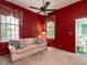 Cozy living room features a ceiling fan, two large windows, and comfortable seating at 1930 Reid St, Raleigh, NC 27608