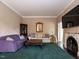 Classic living room design with a fireplace and elegant furnishings at 1930 Reid St, Raleigh, NC 27608
