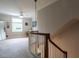 Upper level landing features natural light, carpeted floors, and stairway at 1930 Reid St, Raleigh, NC 27608
