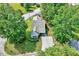 Aerial view of the house with lush trees, a long driveway, and a well-maintained lawn at 2 Donnelly Ct, Durham, NC 27713