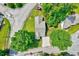 Aerial view of the house, showcasing its position in the neighborhood with surrounding trees and landscaping at 2 Donnelly Ct, Durham, NC 27713