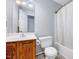 Bathroom with wooden cabinets, tile floor, shower and tub at 2 Donnelly Ct, Durham, NC 27713