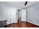 Bedroom with hardwood floors features a closet and white walls at 2 Donnelly Ct, Durham, NC 27713