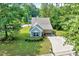 Exterior view of the house with well-maintained lawn and manicured landscaping at 2 Donnelly Ct, Durham, NC 27713