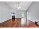 Living room boasts wood floors, fireplace, patio doors and abundant light; perfect for relaxing at 2 Donnelly Ct, Durham, NC 27713