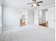 Large bedroom with carpet, ceiling fan, and doors leading to the bathroom at 203 S South Bend Dr, Durham, NC 27713