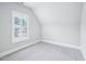 Bedroom with neutral carpet and natural light through the window at 203 S South Bend Dr, Durham, NC 27713