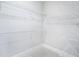 Walk-in closet with white wire shelving and neutral carpeting providing ample storage space at 203 S South Bend Dr, Durham, NC 27713