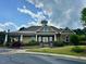 Community clubhouse featuring hardiplank siding, a tin roof and well manicured landscaping at 203 S South Bend Dr, Durham, NC 27713