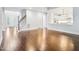Open floor plan with hardwood floors and staircase leading upstairs at 203 S South Bend Dr, Durham, NC 27713
