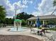 Community splash pad with tables and chairs in a well maintained area at 203 S South Bend Dr, Durham, NC 27713