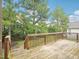 Wooden deck overlooks treed backyard at 203 South Bend Dr, Durham, NC 27713