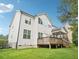 Two story home with wood siding, deck, and manicured lawn at 203 South Bend Dr, Durham, NC 27713