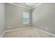 Neutral bedroom featuring a ceiling fan and carpet and a window with blinds at 204 Southern Style Dr, Holly Springs, NC 27540