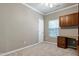 Neutral bedroom featuring a ceiling fan, built in desk and storage cabinet with carpet at 204 Southern Style Dr, Holly Springs, NC 27540